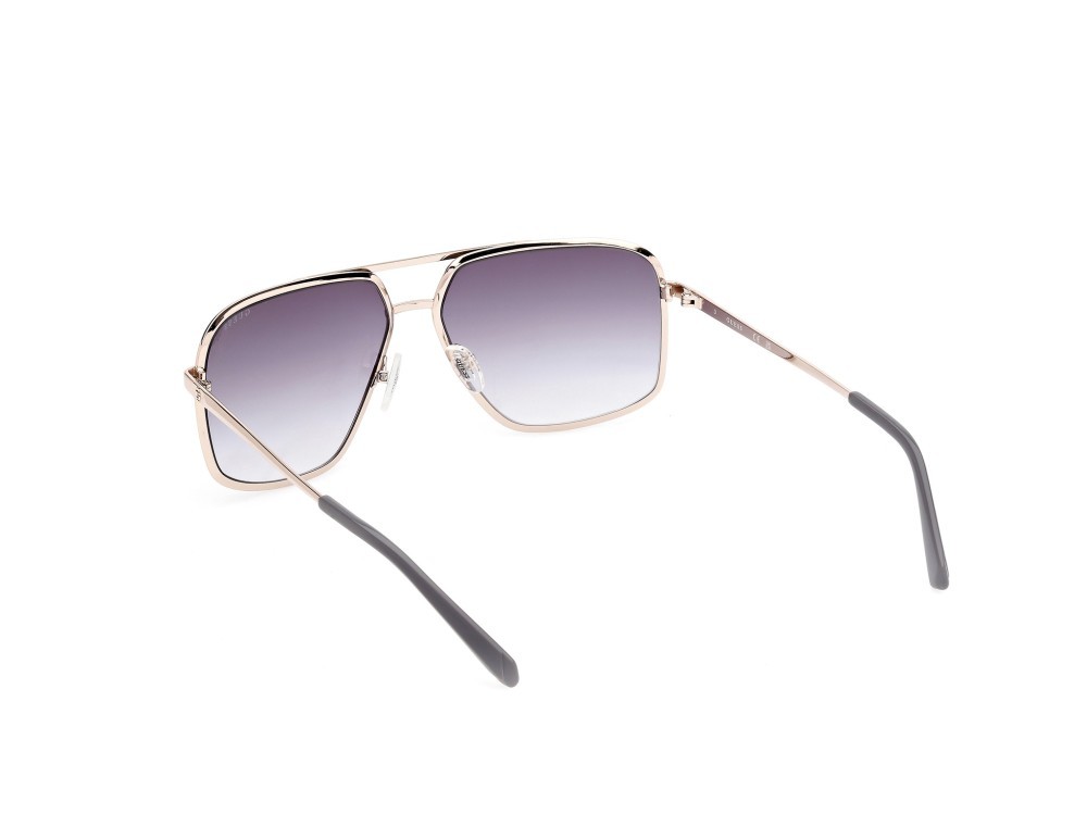 Occhiali da sole Guess GU00167 (20B) colore grigio opaco - oro pallido lucido forma navigator lenti fumo grad.