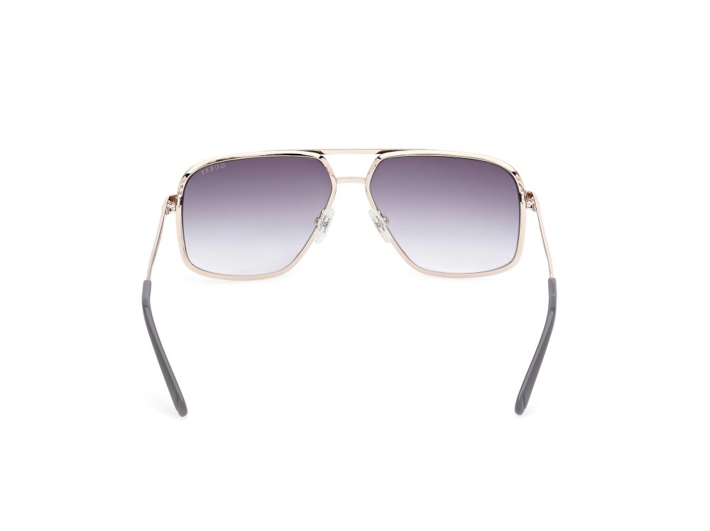 Occhiali da sole Guess GU00167 (20B) colore grigio opaco - oro pallido lucido forma navigator lenti fumo grad.