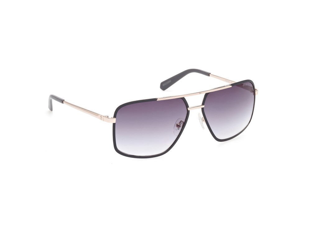 Occhiali da sole Guess GU00167 (20B) colore grigio opaco - oro pallido lucido forma navigator lenti fumo grad.