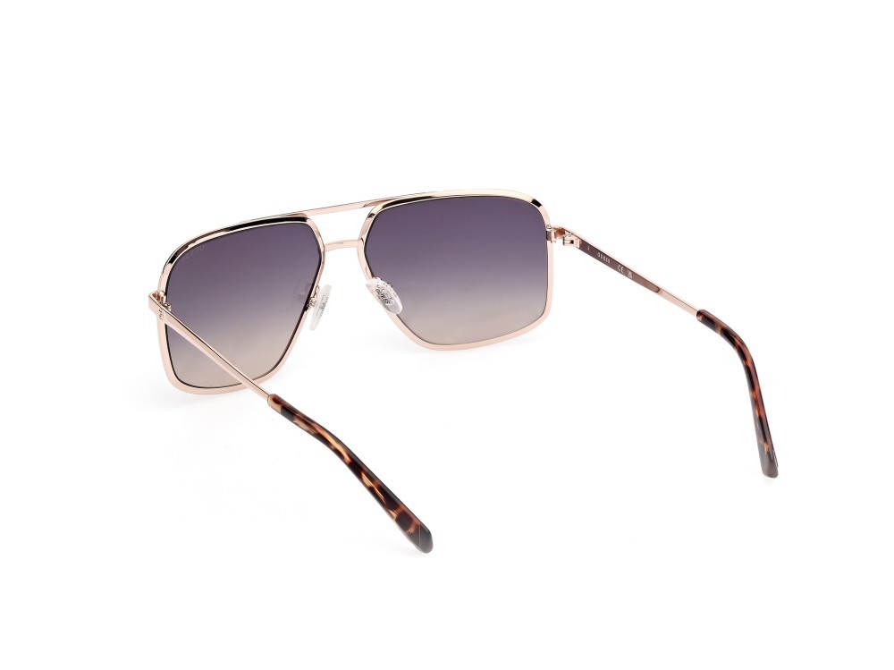 Occhiali da sole Guess GU00167 (32W) colore oro pallido opaco - oro pallido lucido forma navigator lenti blu sfumato