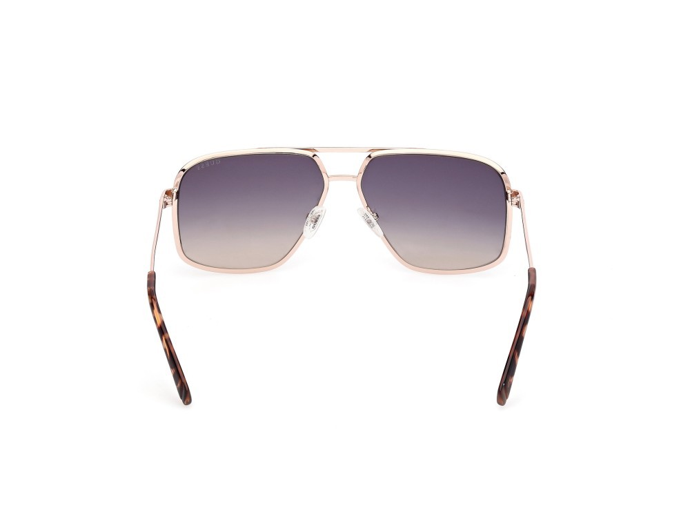 Occhiali da sole Guess GU00167 (32W) colore oro pallido opaco - oro pallido lucido forma navigator lenti blu sfumato