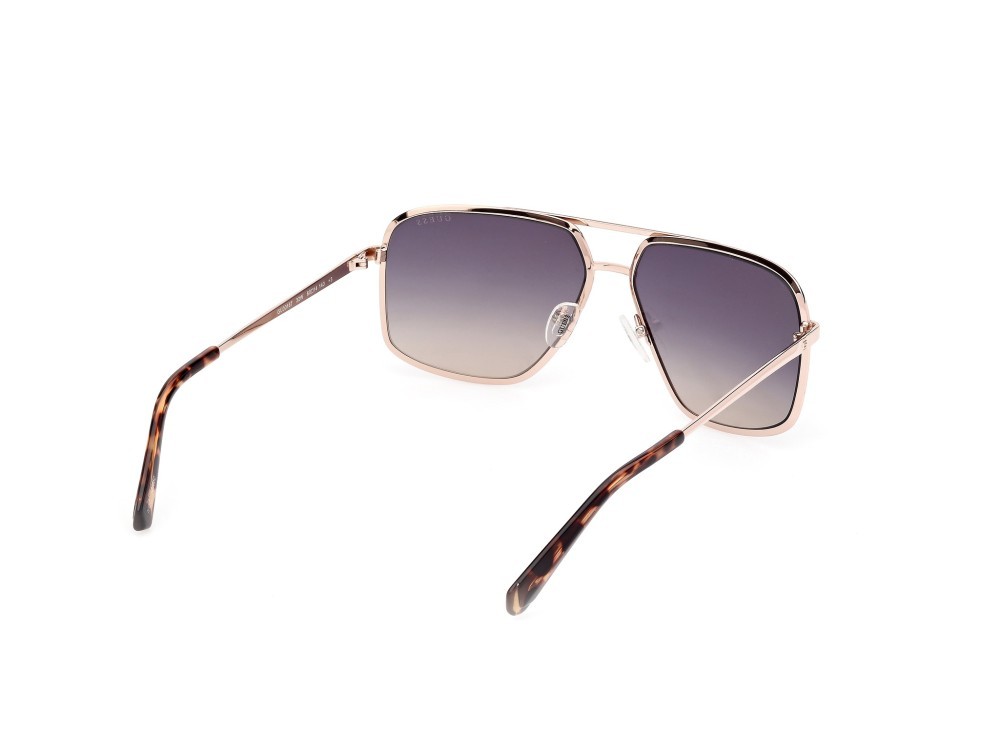 Occhiali da sole Guess GU00167 (32W) colore oro pallido opaco - oro pallido lucido forma navigator lenti blu sfumato