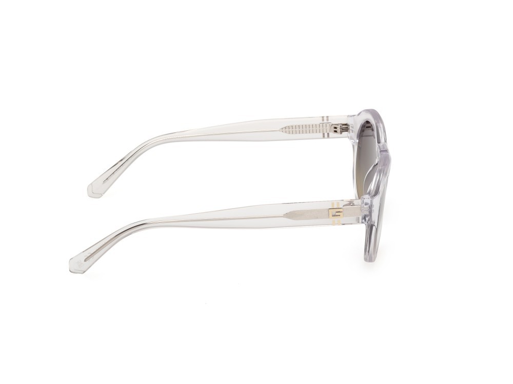 Occhiali da sole Guess GU00205 (26W) colore cristallo / giallo chiaro lucido forma rotondo lenti blu sfumato