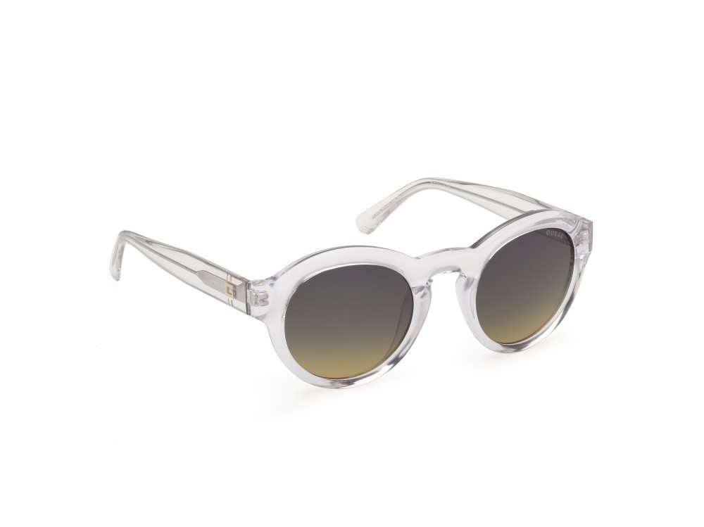 Occhiali da sole Guess GU00205 (26W) colore cristallo / giallo chiaro lucido forma rotondo lenti blu sfumato