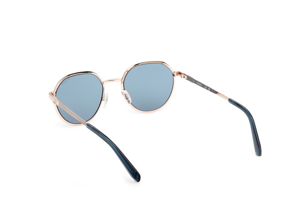 Occhiali da sole Guess GU00207 (32V) colore oro pallido lucido forma rotondo lenti blu