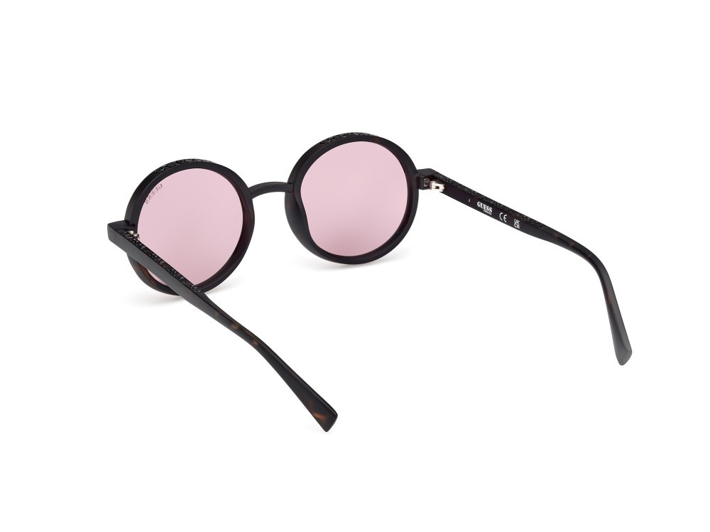 Occhiali da sole Guess GU00234 (52Y) colore avana scura forma rotondo lenti viola