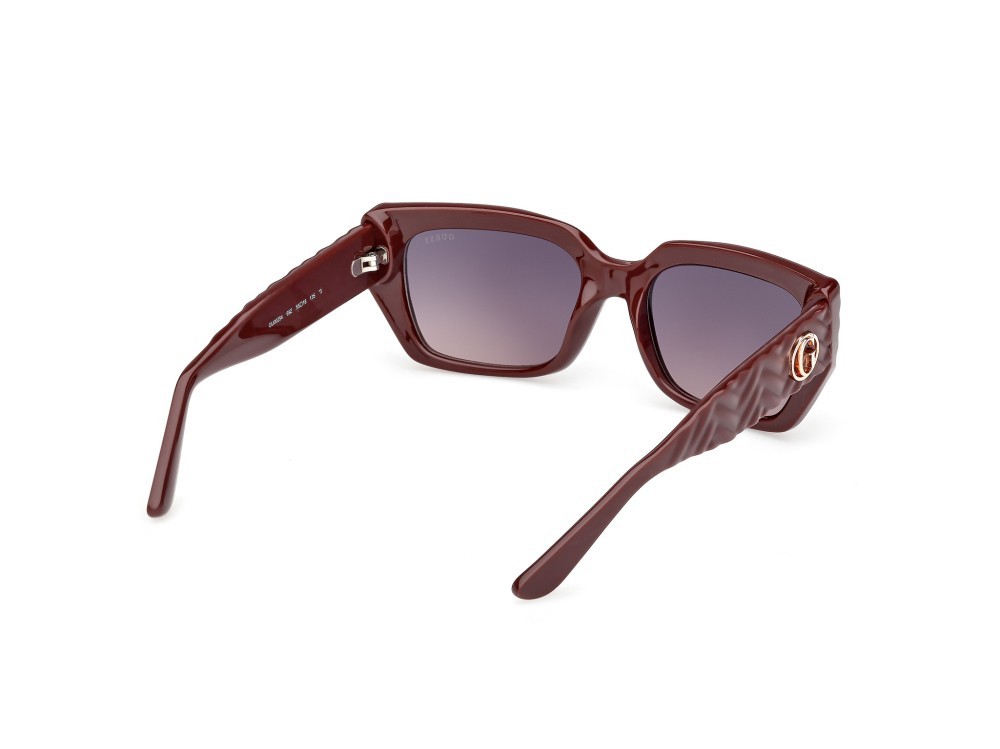 Occhiali da sole Guess GU00254 (69Z) colore bordeaux lucido / bordeaux opaco forma rettangolare lenti viola sfumato o specchiato