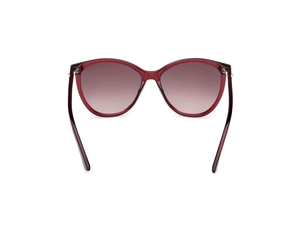 Occhiali da sole Guess GU00256 (69F) colore bordeaux lucido forma cat eye lenti marrone sfumato