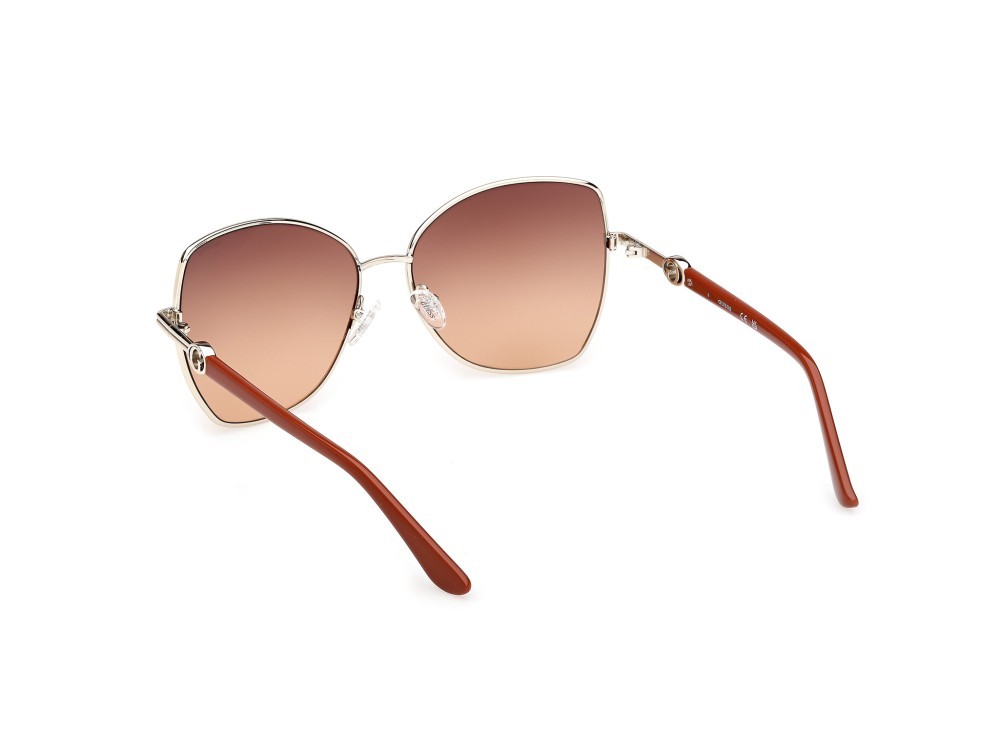 Occhiali da sole Guess GU00259 (32F) colore oro pallido lucido / arancio scuro lucido forma farfalla lenti marrone sfumato
