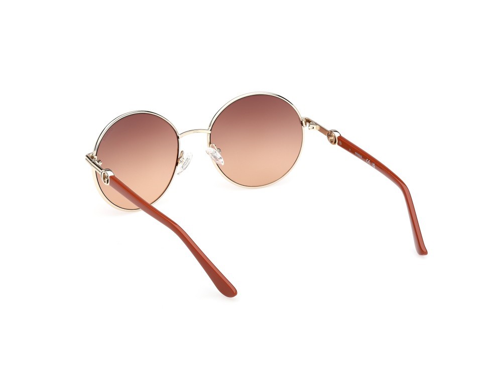 Occhiali da sole Guess GU00260 (32F) colore oro pallido lucido / arancio scuro lucido forma rotondo lenti marrone sfumato
