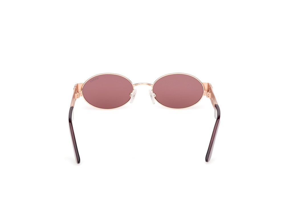 Occhiali da sole Guess GU00262 (28Y) colore oro rosé lucido forma ovale lenti viola