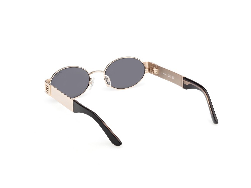 Occhiali da sole Guess GU00262 (32A) colore oro pallido lucido forma ovale lenti fumo