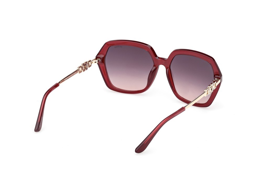Occhiali da sole Guess GU00267 (69Z) colore bordeaux lucido / oro endura lucido forma geometrico lenti viola sfumato o specchiato
