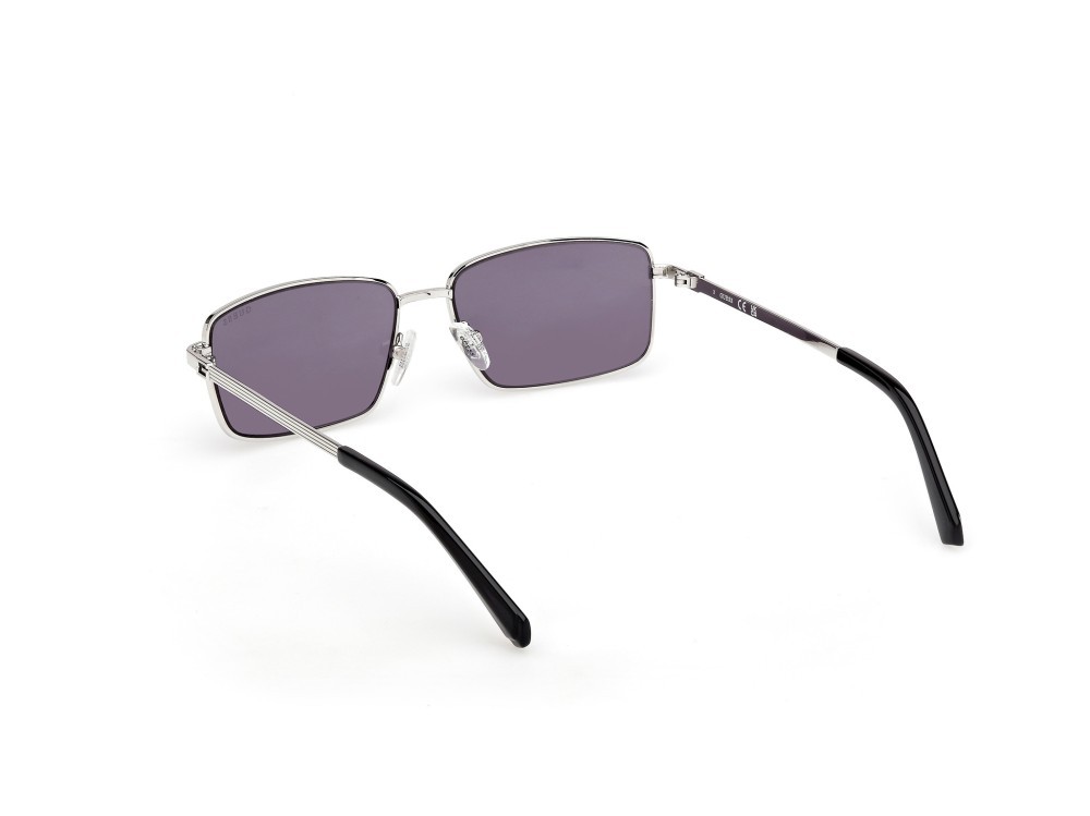 Occhiali da sole Guess GU00273 (10Y) colore rutenio chiaro lucido forma rettangolare lenti viola