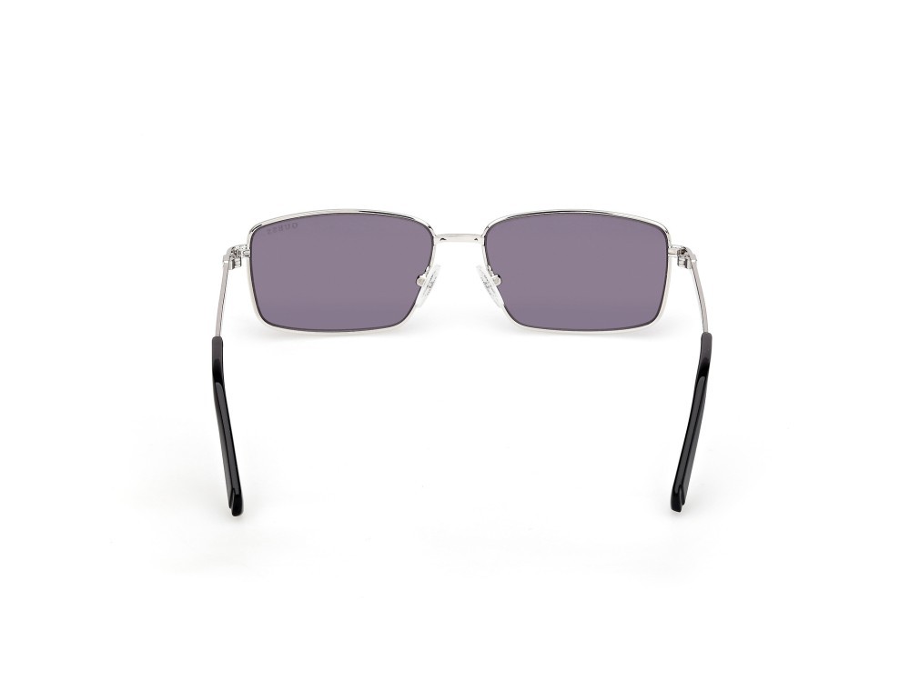 Occhiali da sole Guess GU00273 (10Y) colore rutenio chiaro lucido forma rettangolare lenti viola