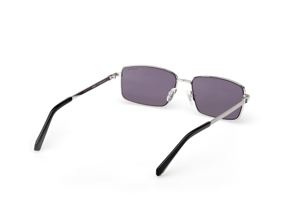 Occhiali da sole Guess GU00273 (10Y) colore rutenio chiaro lucido forma rettangolare lenti viola