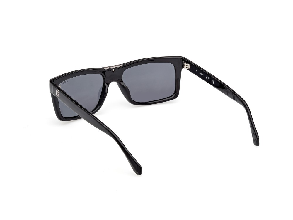 Occhiali da sole Guess GU00274 (01D) colore nero lucido forma rettangolare lenti fumo polar.