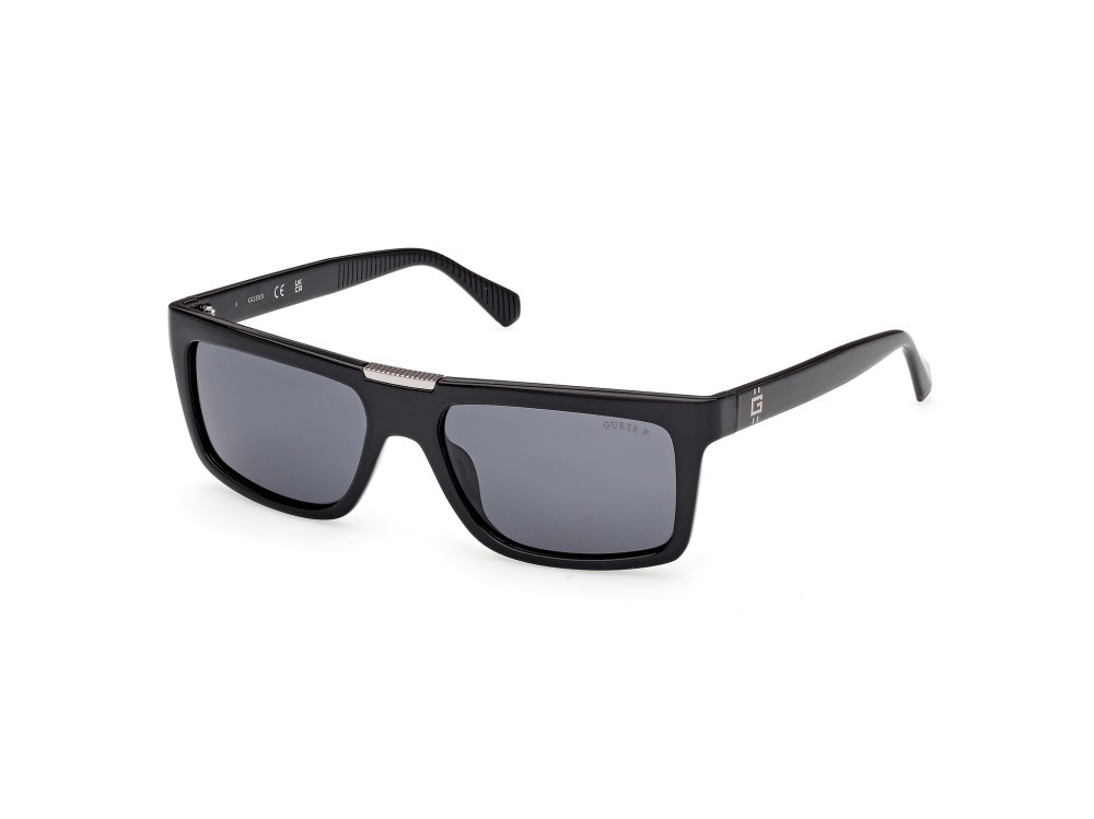 Occhiali da sole Guess GU00274 (01D) colore nero lucido forma rettangolare lenti fumo polar.
