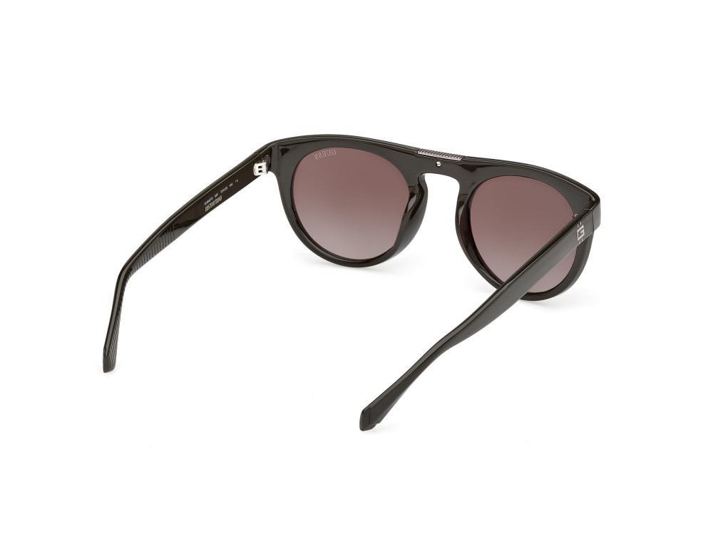 Occhiali da sole Guess GU00275 (96F) colore verde scuro lucido forma rotondo lenti marrone sfumato