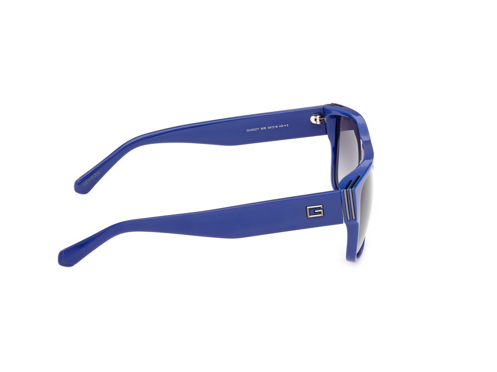 Occhiali da sole Guess GU00277 (90B) colore blu lucido forma quadrato lenti fumo grad.