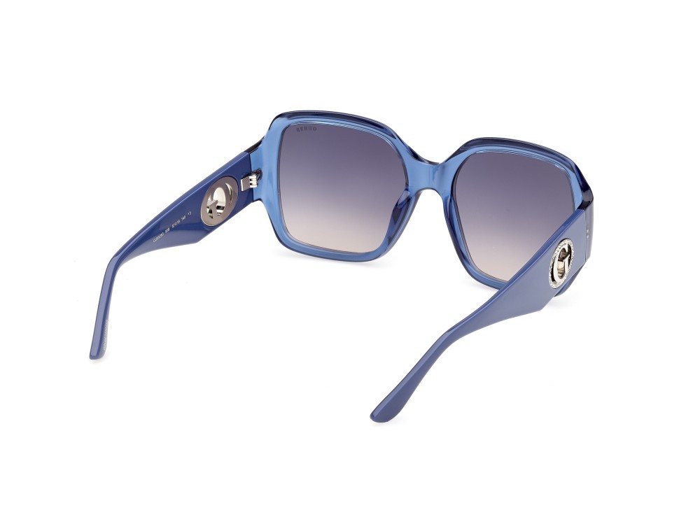 Occhiali da sole Guess GU00283 (90B) colore blu lucido  forma quadrato lenti fumo grad.