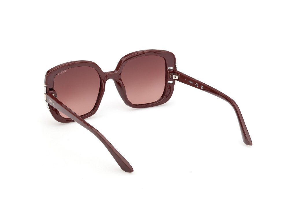 Occhiali da sole Guess GU00294 (69F) colore bordeaux lucido forma quadrato lenti marrone sfumato