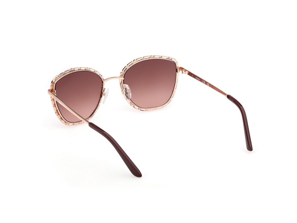 Occhiali da sole Guess GU00297 (28F) colore oro rosé lucido  forma rotondo lenti marrone sfumato