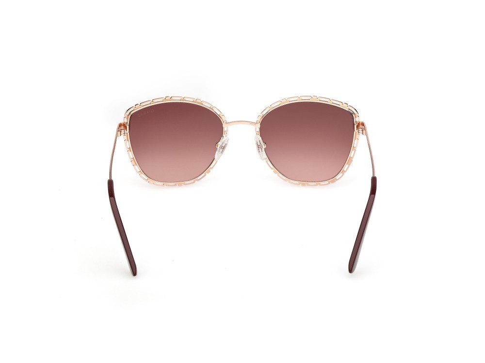 Occhiali da sole Guess GU00297 (28F) colore oro rosé lucido  forma rotondo lenti marrone sfumato