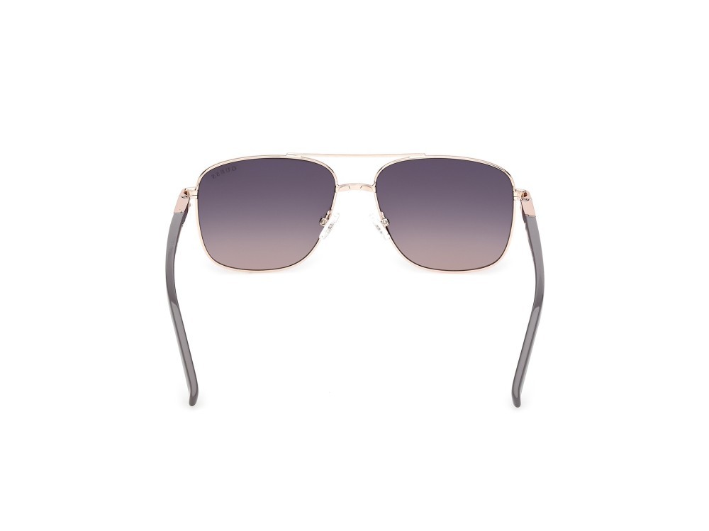 Occhiali da sole Guess GU3040 (28B) colore oro rosé lucido forma navigator lenti fumo grad.