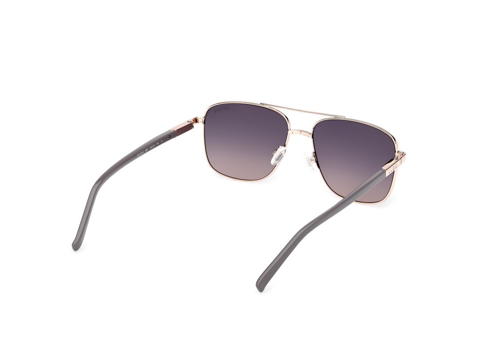 Occhiali da sole Guess GU3040 (28B) colore oro rosé lucido forma navigator lenti fumo grad.