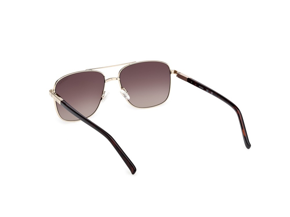 Occhiali da sole Guess GU3040 (33F) colore oro pallido lucido  forma navigator lenti marrone sfumato