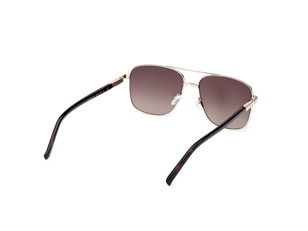 Occhiali da sole Guess GU3040 (33F) colore oro pallido lucido  forma navigator lenti marrone sfumato