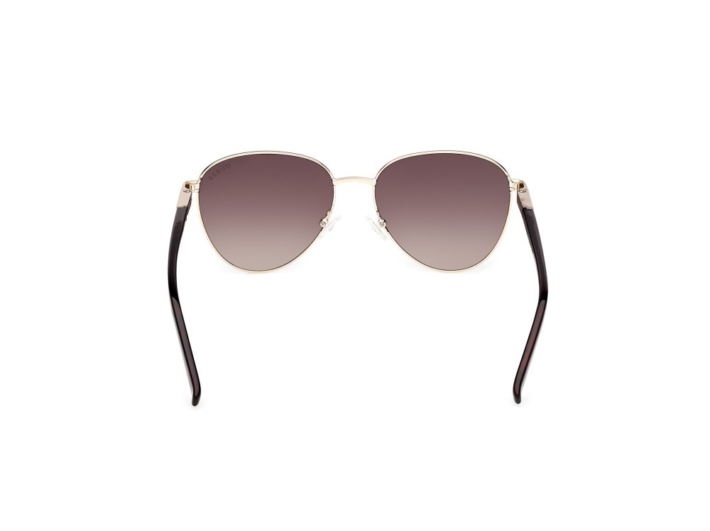 Occhiali da sole Guess GU3041 (33F) colore oro pallido lucido forma rotondo lenti marrone sfumato