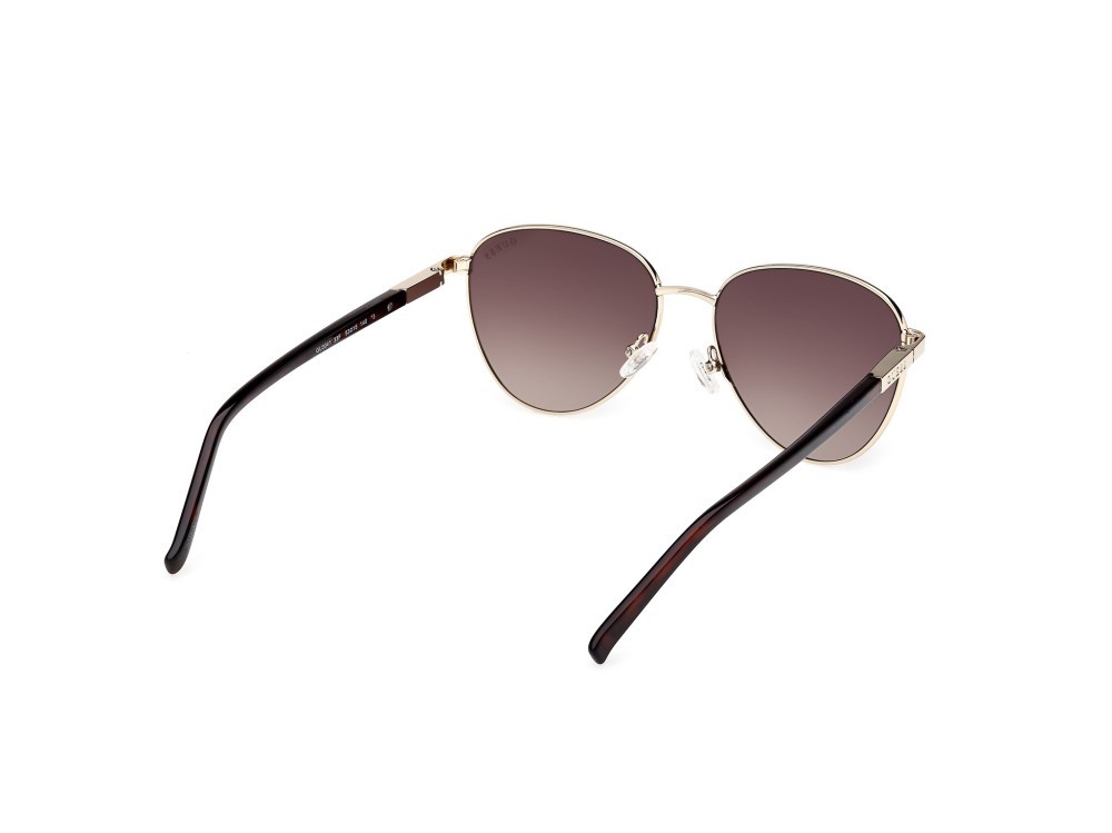 Occhiali da sole Guess GU3041 (33F) colore oro pallido lucido forma rotondo lenti marrone sfumato