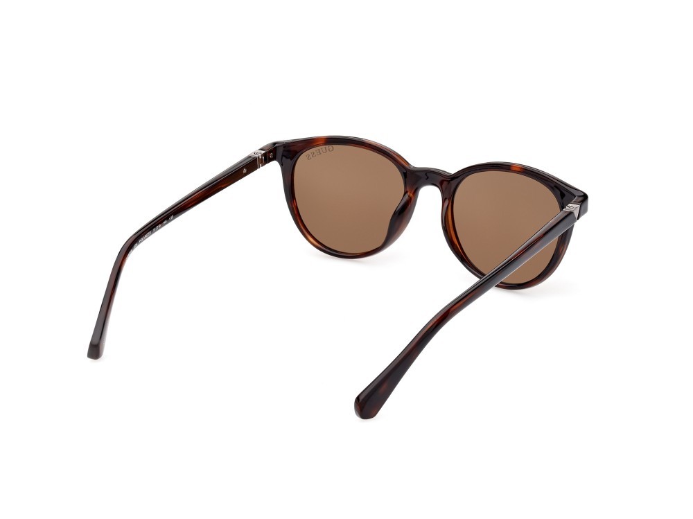 Occhiali da sole Guess GU5216 (52H) colore avana scura forma rotondo lenti marrone polar.