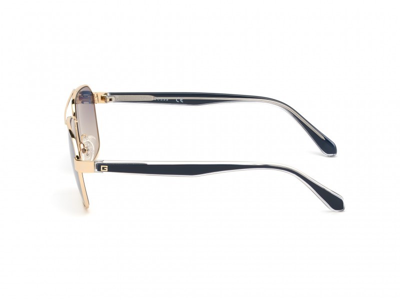 Occhiali da sole Guess GU6936 (32W) colore oro forma geometrico lenti blu grad.