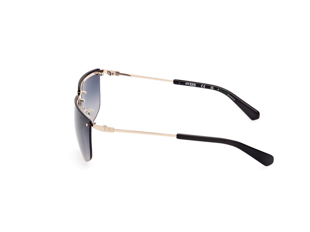 Occhiali da sole Guess GU8256 (32B) colore oro  forma rettangolare lenti fumo grad.