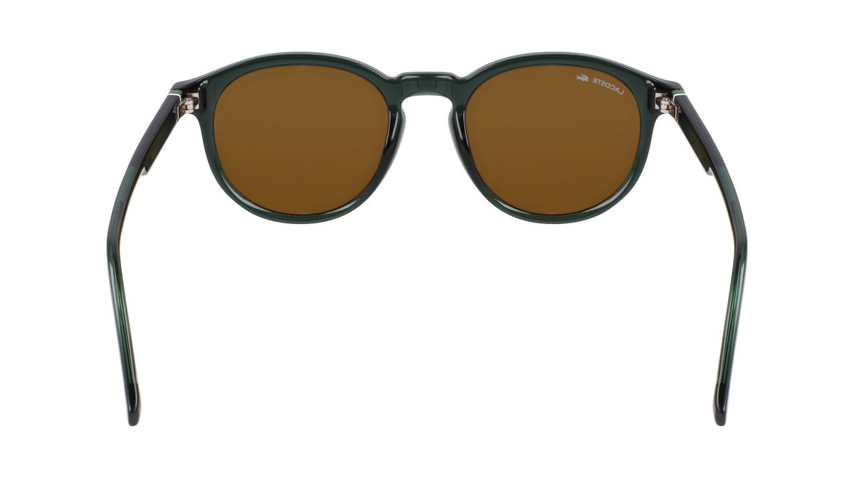 Occhiali da sole Lacoste L6030S (301) colore transparent green forma rotondo lenti brown