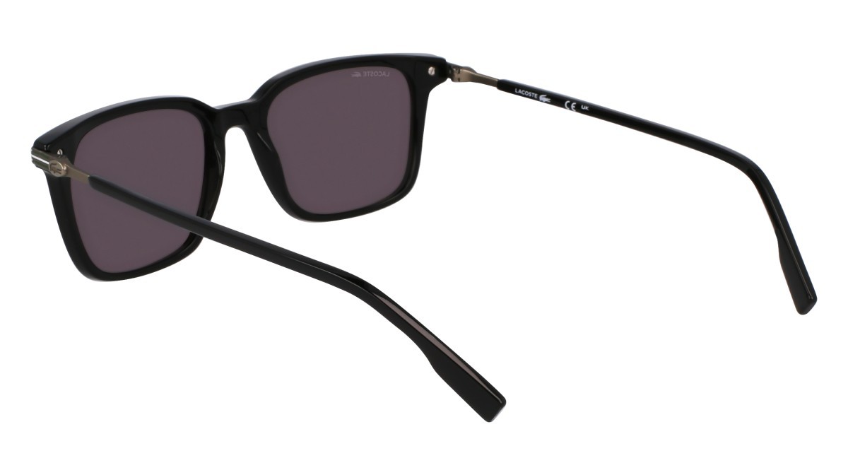 Sonnenbrillen Lacoste L6035S (001) farbe black form rund gläser solid grey