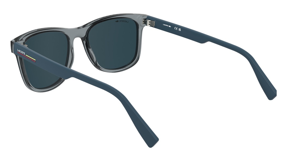 Occhiali da sole Lacoste L6054S (035) colore transparent grey forma rettangolare lenti solid blue