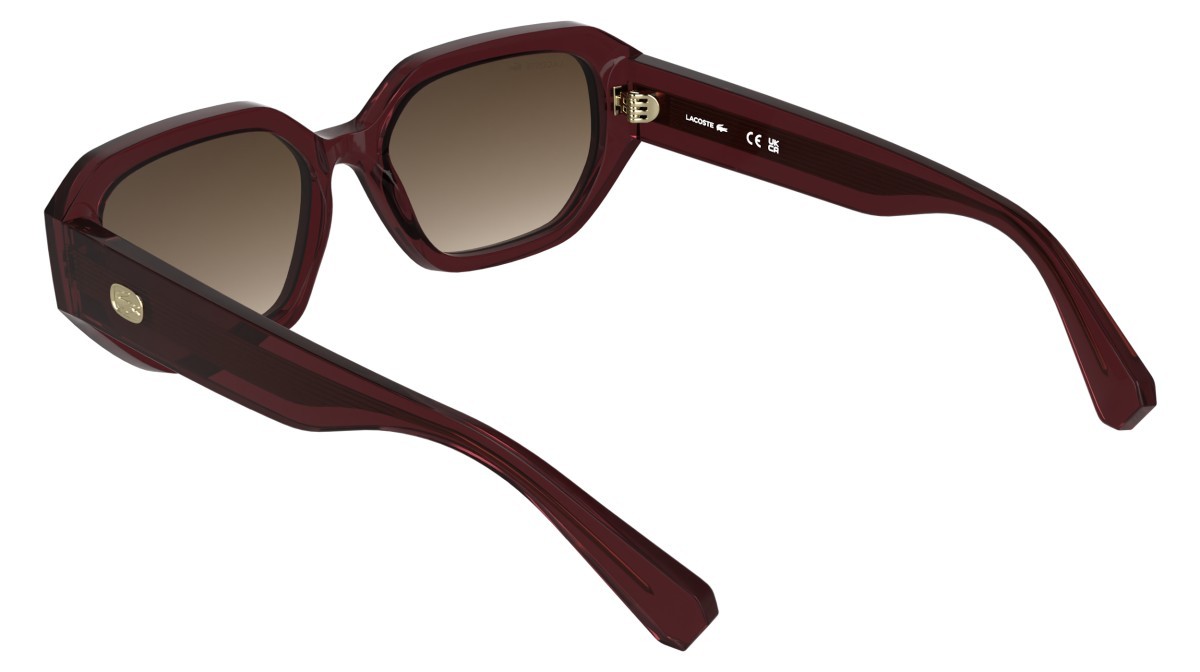 Occhiali da sole Lacoste L6091S (601) colore transparent burgundy forma rettangolare lenti gradient brown
