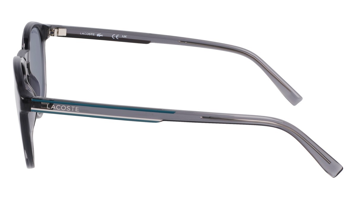 Sunglasses Lacoste L916S N (038) color transparent grey shape round lenses solid blue