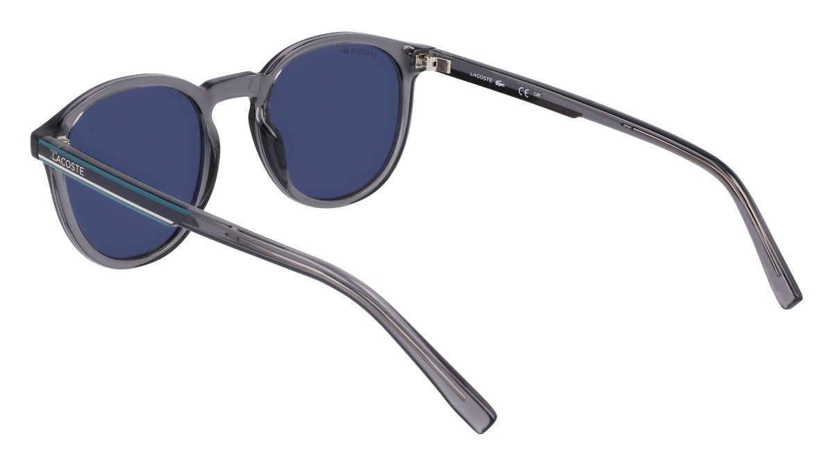 Sunglasses Lacoste L916S N (038) color transparent grey shape round lenses solid blue