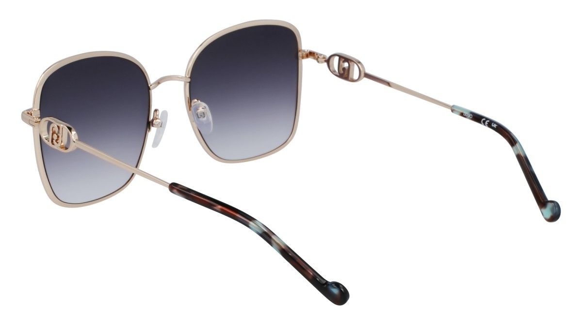 Occhiali da sole Liu Jo LJ155S (711) colore shiny gold forma rettangolare lenti gradient petrol