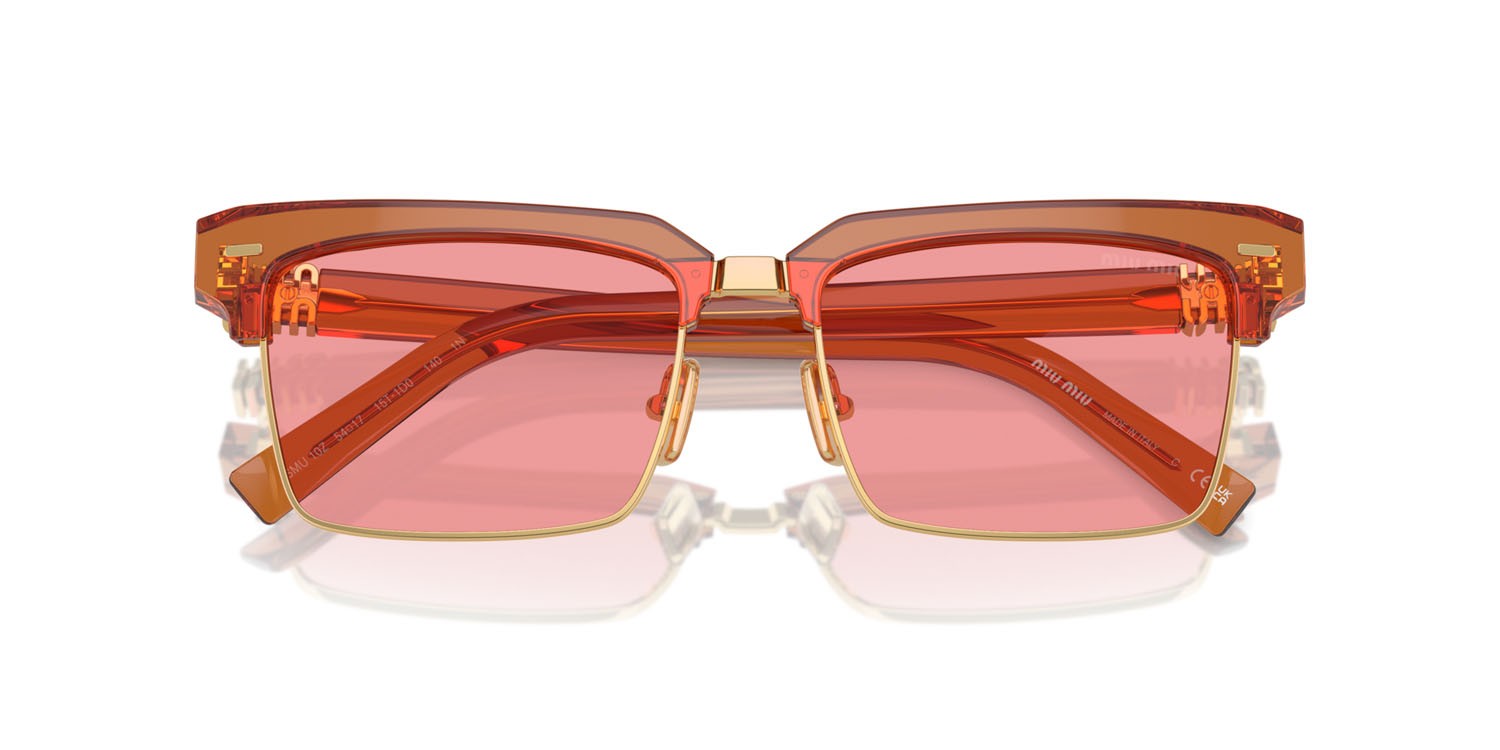 Occhiali da sole Miu Miu MU 10ZS (15T1D0) colore caramel trasparent forma quadrato lenti rosa