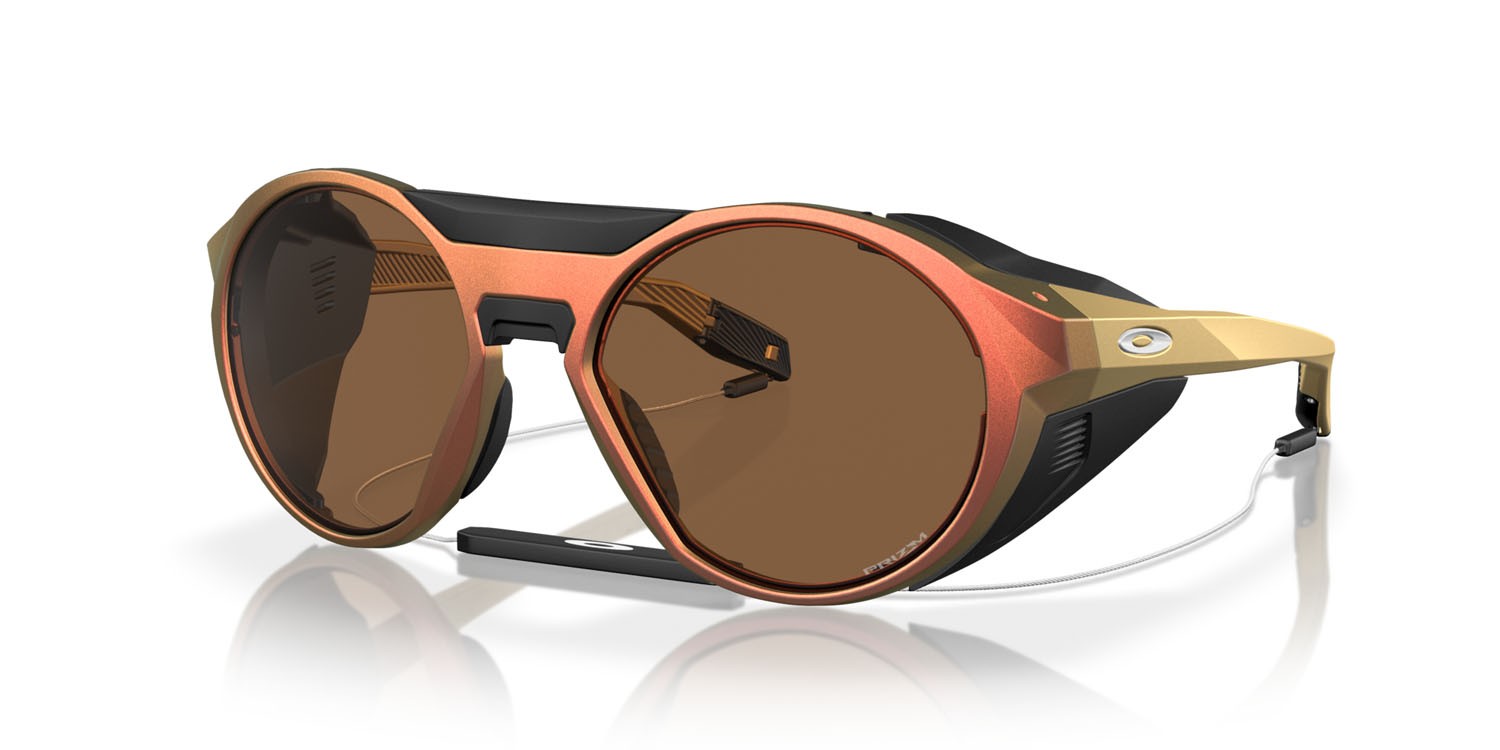 Occhiali da sole Oakley Clifden OO 9440 (944023) colore matte red gold colorshift forma rotondo lenti prizm bronze