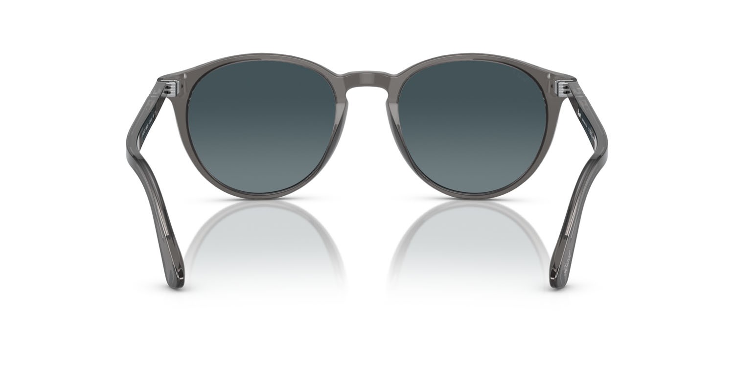 Occhiali da sole Persol PO 3152S (1196S3) colore grigio trasparente forma rotondo lenti light blue gradient dark blue polar