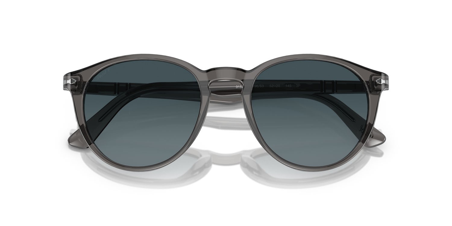 Occhiali da sole Persol PO 3152S (1196S3) colore grigio trasparente forma rotondo lenti light blue gradient dark blue polar