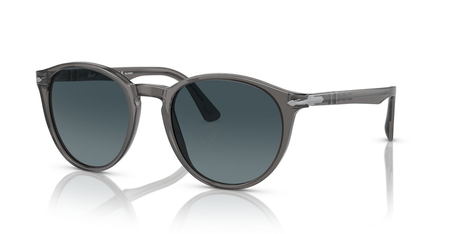 Occhiali da sole Persol PO 3152S (1196S3) colore grigio trasparente forma rotondo lenti light blue gradient dark blue polar