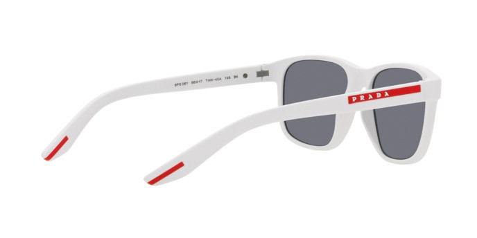 Occhiali da sole Prada Linea Rossa PS 06YS (TWK40A) colore bianco effetto gommato forma quadrato lenti azzurro specchiato argento